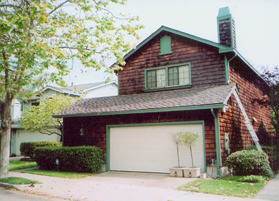 Shingle siding above garage and around chimney to be replaced