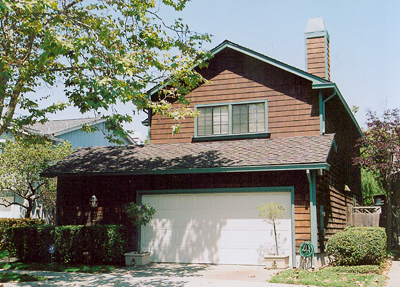 Shingle siding above garage and around chimney replaced and stained to match house